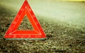 Breakdown of car. Red warning triangle sign on road Royalty Free Stock Photo