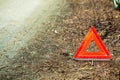 Breakdown of car. Red warning triangle sign on road Royalty Free Stock Photo