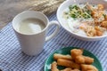 Breakfase meal. Close up glass of soy milk with Congee or Rice porridge minced pork, boiled egg and Chinese deep fried double
