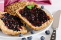 Breakfast arrangement with buns and blueberry jam Royalty Free Stock Photo