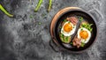Breakfast with asparagus, egg, bacon and toast on dark background. Long banner format, top view Royalty Free Stock Photo