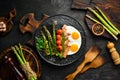 Breakfast. Asparagus, eggs, bacon and cherry tomatoes. Healthy food. Top view. Royalty Free Stock Photo