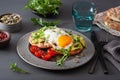 Breakfast avocado sandwich with fried egg and tomato Royalty Free Stock Photo