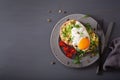 Breakfast avocado sandwich with fried egg and tomato Royalty Free Stock Photo