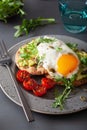 Breakfast avocado sandwich with fried egg and tomato Royalty Free Stock Photo