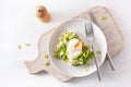 Breakfast avocado sandwich with poached egg and feta cheese