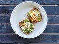 Breakfast: avocado toast with poached egg and chili flakes