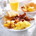 Breakfast with bacon, eggs and home fries Royalty Free Stock Photo