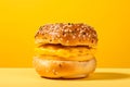 Breakfast Bagel tasty fast food street food for take away on yellow background