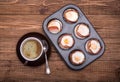 Breakfast baked eggs with bacon in muffin tin.