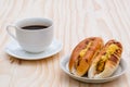 Breakfast with Baker Vietnamese or Viet Nam bread and black coffee on wooden retro background. Royalty Free Stock Photo