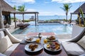 breakfast at a beach with palm trees and pool in Mauritius, tropical setting with breakfast Royalty Free Stock Photo