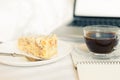 Breakfast in bed with coffee, cake and laptop Royalty Free Stock Photo