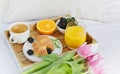 Breakfast in bed, croissant, coffee cup, berries, orange juice, Royalty Free Stock Photo