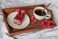 Breakfast in bed. Cup of coffee, red velvet cake Royalty Free Stock Photo