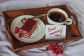 Breakfast in bed. Cup, coffee, red, velvet, cake and note with t