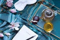 Breakfast in bed flat lay with magnolia flowers and green tea with marshmallows. Tea break concept. Royalty Free Stock Photo