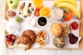 Breakfast in bed with fruits and pastries on a tray -waffles, cr Royalty Free Stock Photo