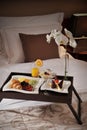 Breakfast in bed at a hotel room Royalty Free Stock Photo