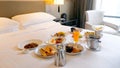 Breakfast in bed in hotel. Room service in modern luxury resort Royalty Free Stock Photo