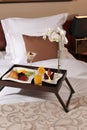 Breakfast in bed at a hotel room Royalty Free Stock Photo