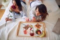 Breakfast in bed.Romantic couple having breakfast in bed Royalty Free Stock Photo