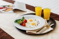 Breakfast on the bed, scrambled eggs with vegetables and two glasses of orange juice in the early morning cheers up. Healthy food Royalty Free Stock Photo