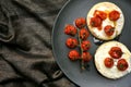 Breakfast in bed with toasted tomatoes on crumpets