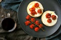Breakfast in bed with toasted tomatoes on crumpets