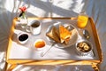 Breakfast in bed on tray at sunny morning at home on Mother`s Day Royalty Free Stock Photo