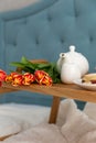 Breakfast in bed on a wooden table tray. Morning light. Flowers Royalty Free Stock Photo