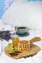 Breakfast with Belgian waffles, apricot jam and coffee Royalty Free Stock Photo