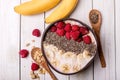 Breakfast berry smoothie bowl topped with banana,raspberry, blackberry and chia seeds. soft focus . top view. Healthy vegan food Royalty Free Stock Photo