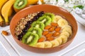 Breakfast berry smoothie bowl topped with bananas, berries, kiwi Royalty Free Stock Photo