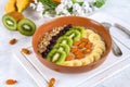 Breakfast berry smoothie bowl topped with bananas, berries, kiwi Royalty Free Stock Photo