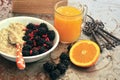 Breakfast with blackberries ,goji seeds and orange juice