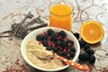 Breakfast with blackberries ,goji seeds and orange juice