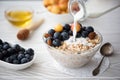 breakfast with blueberry and yellow cherries oatmeal poured milk Royalty Free Stock Photo