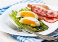 Breakfast: boiled egg, baked asparagus Royalty Free Stock Photo