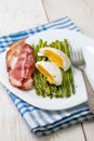 Breakfast: boiled egg, baked asparagus Royalty Free Stock Photo