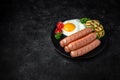 Breakfast of boiled sausages, fried eggs. Royalty Free Stock Photo