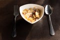 Breakfast bowl of cornflake and milk with spoon and fork in the morning. Royalty Free Stock Photo