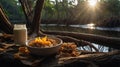 Delicious Granola Breakfast by the River at Sunrise Royalty Free Stock Photo
