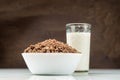 Breakfast bowl nut muesli with milk. Spilled muesli. Royalty Free Stock Photo