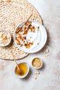 Breakfast bowls with granola, yogurt, coconut chips and honey. Healthy vegan, vegetarian breakfast