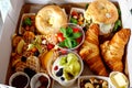 Breakfast in a box to go from closed restaurant due corona virus lockdown. Fresh bagels, croissants, berries, salad and