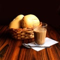 Breakfast in Brazil. Coffee and milk. French breads in a wicker basket Royalty Free Stock Photo