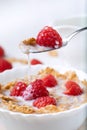 Breakfast with brown rice flakes, milk and fresh raspberries Royalty Free Stock Photo