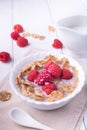 Breakfast with brown rice flakes, milk and fresh raspberries Royalty Free Stock Photo