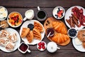 Breakfast or brunch table scene on a dark wood background Royalty Free Stock Photo